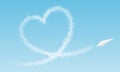 Airplane flies a cloud heart in front of blue sky