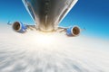 Airplane flies over the clouds in the sky. View of the fuselage, wings and engines, blurred effect motion light. Royalty Free Stock Photo