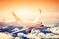Airplane in flight. A big passenger or cargo aircraft, airline above clouds. Royalty Free Stock Photo
