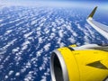 Airplane flight. Wing of an airplane flying above the clouds and sea in La Palma, Canary Islands. View from the window of the Royalty Free Stock Photo