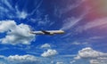 The airplane in the sky full of fluffy clouds sky sunny day Royalty Free Stock Photo