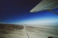 An airplane is fly on the area of Nazca Lines, and is going to take tourists over the Nazca Lines. We can the see the highway, des Royalty Free Stock Photo