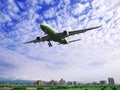 Airplane fly over buildings Royalty Free Stock Photo