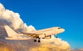 Airplane at fly on the sky with clouds sunset Royalty Free Stock Photo