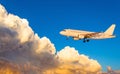 Airplane at fly on the sky with clouds sunset Royalty Free Stock Photo