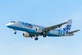 Airplane Flybe G-FBJB Embraer ERJ-175 is landing at Schiphol airport.