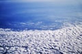 View from airplane window engine and wing flying above the clouds Royalty Free Stock Photo