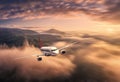 Airplane is flying above the clouds at sunset in summer Royalty Free Stock Photo