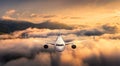 Airplane is flying above the clouds at sunset in summer Royalty Free Stock Photo