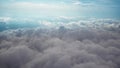 Airplane flying above clouds