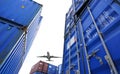 Airplane flying above container logistic. Cargo and shipping business. Container ship for import and export logistic. Logistic Royalty Free Stock Photo