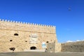 Airplane flying above fortress Koules in Heraclion on Crete Royalty Free Stock Photo