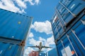 Airplane flying above logistic container. Air logistics. Cargo and shipping business. Container ship for import and export Royalty Free Stock Photo