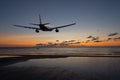 Airplane flying above the sea in sky with clouds Royalty Free Stock Photo