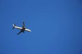 Airplane flying against blue sky Royalty Free Stock Photo