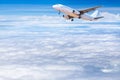 airplane flying away in to clear sky with white clouds Royalty Free Stock Photo