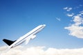 An airplane flying in the blue sky Royalty Free Stock Photo