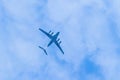 Airplane is flying in blue sky. Commercial passenger and cargo a Royalty Free Stock Photo