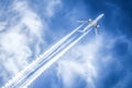 Airplane flying in a blue sky leaving a trail Royalty Free Stock Photo