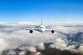 Airplane flying in the clouds. Front view aircraft