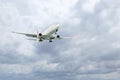 Airplane flying high in cloudy sky. Modern aircraft Royalty Free Stock Photo