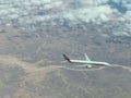 Airplane flying over the clouds. A large white plane.