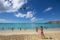 Airplane flying over Maho Beach, Sint Maarten, Dutch Caribbean Royalty Free Stock Photo