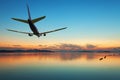 Airplane flying over tropical sea at beautiful sunset or sunrise Royalty Free Stock Photo