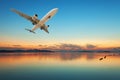 Airplane flying over tropical sea at beautiful sunset or sunrise Royalty Free Stock Photo