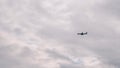 Airplane flying in sky. Plane lands at airport. Airplane going to landing. Blue airplane in sky. Jet flies in sky. Aircraft landin