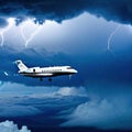 Airplane flying through storm clouds with Private jet