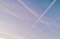 Airplane footprints folded into a geometric pattern with crossed lines in the sky, background Royalty Free Stock Photo