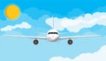 Airplane front view in the sky with clouds and sun Royalty Free Stock Photo