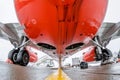 Airplane fuselage and main landing gear repair, bottom view close up.