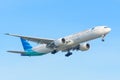 Airplane Garuda Indonesia PK-GIC Boeing 777-300 is landing at Schiphol airport. Royalty Free Stock Photo