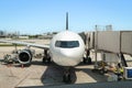 Airplane at the gate, ready for boarding.