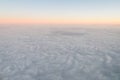 Airplane illuminator view on fluffy clouds and sunrise sky. Clouds view from the aircraft illuminator
