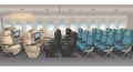Airplane interior featuring three seating classes. The left side shows beige, spacious Royalty Free Stock Photo