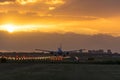 Airplane almost landed during a nice sunrise. Royalty Free Stock Photo