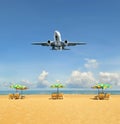 Airplane landing above beautiful beach