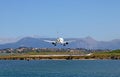 Airplane landing on airport Corfu town Royalty Free Stock Photo