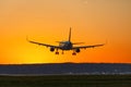 Airplane landing airport sun sunset vacation holidays travel traveling plane Royalty Free Stock Photo