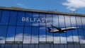 Airplane landing at Belfast Ireland airport mirrored in terminal