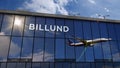 Airplane landing at Billund Denmark airport mirrored in terminal