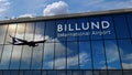 Airplane landing at Billund Denmark airport mirrored in terminal