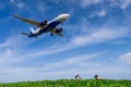 airplane landing with blue sky background at Phuket airport, Thailand Royalty Free Stock Photo