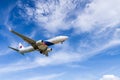 airplane landing with blue sky background at Phuket airport, Thailand Royalty Free Stock Photo