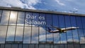 Airplane landing at Dar es Salaam Tanzania airport mirrored in terminal Royalty Free Stock Photo