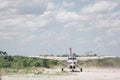 Airplane landing on dirt track