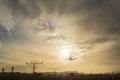 Airplane landing at dusk Royalty Free Stock Photo